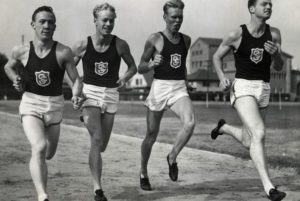 B&W photo of athletes running