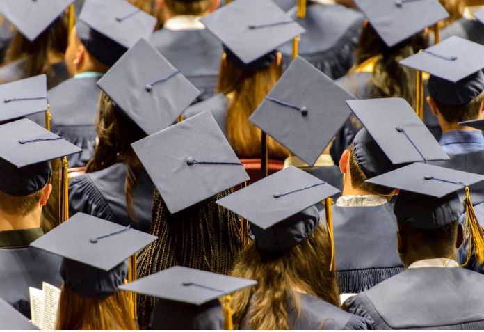 Photo of college graduates in cap and gown